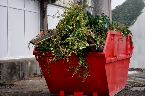 Modern garden clearance equipment at work in Bishops Stortford